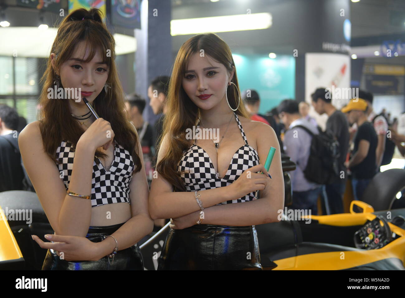 Showgirls display e-cigarettes the 2019 IECIE Shenzhen eCig Expo at Shenzhen Convention & Exhibition Center in Shenzhen city, south China's Guangdong Stock Photo