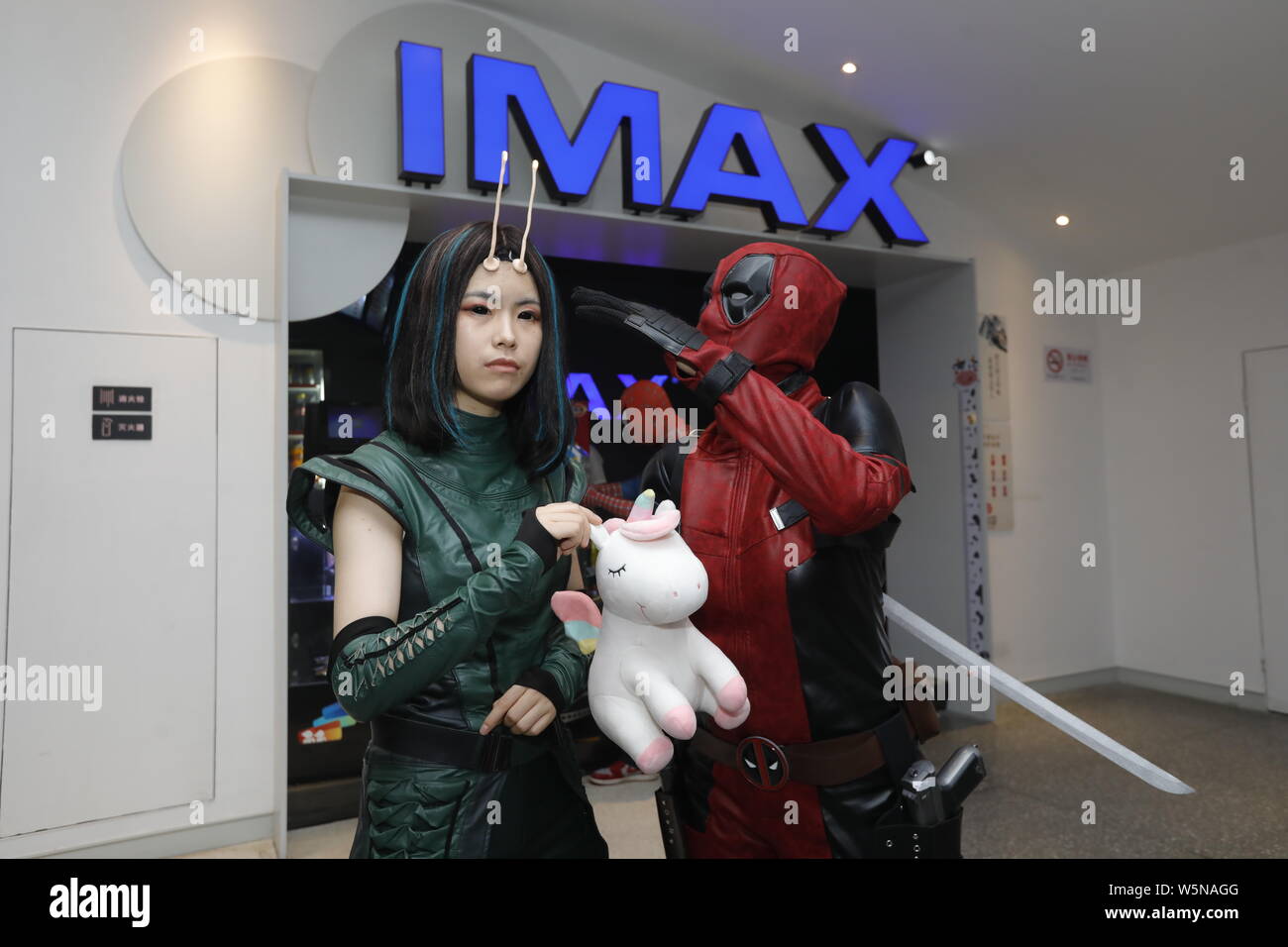 Chinese Filmgoer Wearing Costumes Of Mantis And Deadpool Wait Inside A Cinema Before The Midnight Premiere Of Disney And Marvel S Avengers Endgame Stock Photo Alamy