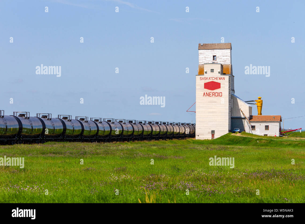 Aneroid, Saskatchewan, Canada - July 8, 2019: Landscape scenic view of old wooden grain elevator in the Canadian prairie town of Aneroid, Saskatchewan Stock Photo