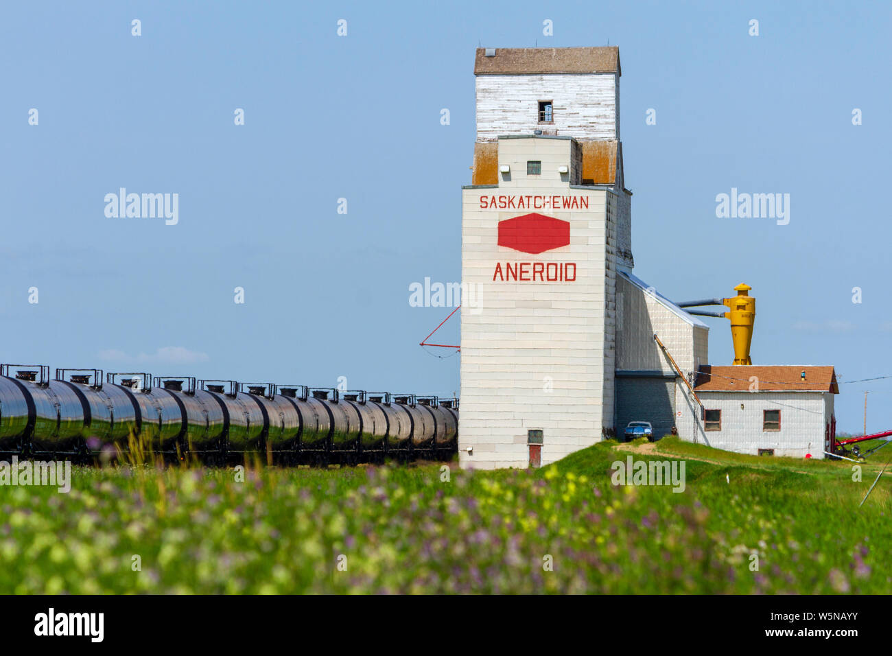 Aneroid, Saskatchewan, Canada - July 8, 2019: Landscape scenic view of old wooden grain elevator in the Canadian prairie town of Aneroid, Saskatchewan Stock Photo
