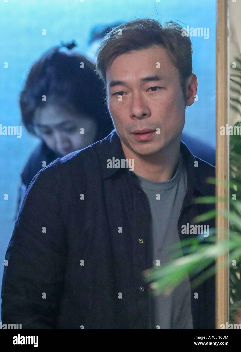 Hong Kong singer Andy Hui or Hui Chi-on arrives for a press conference to apologize to the public for cheating on his superstar wife Sammi Cheng in Ho Stock Photo