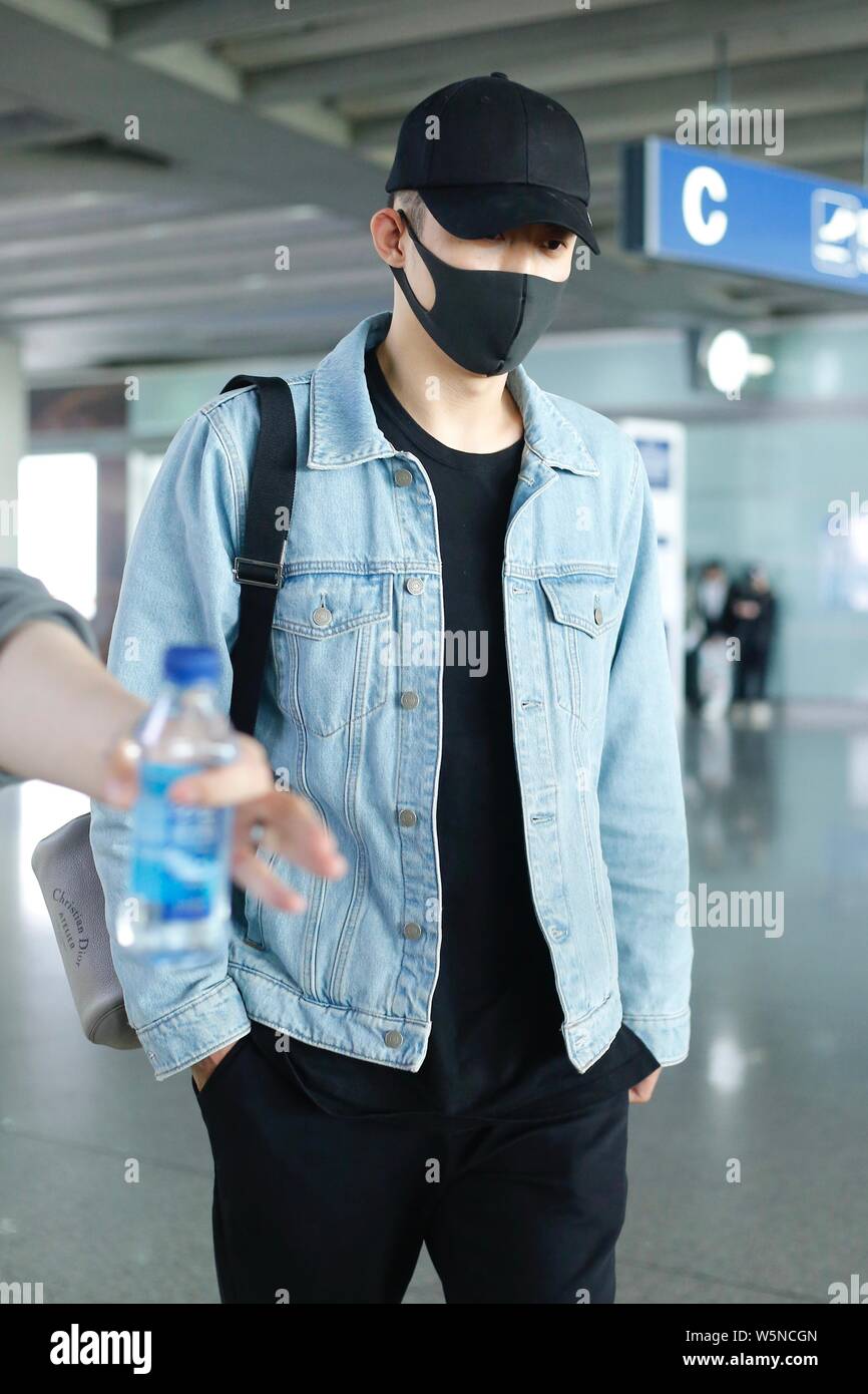 Chinese actor and model Huang Jingyu, also known as Johnny Huang arrives at the Beijing Capital International Airport in Beijing, China, 30 April 2019 Stock Photo