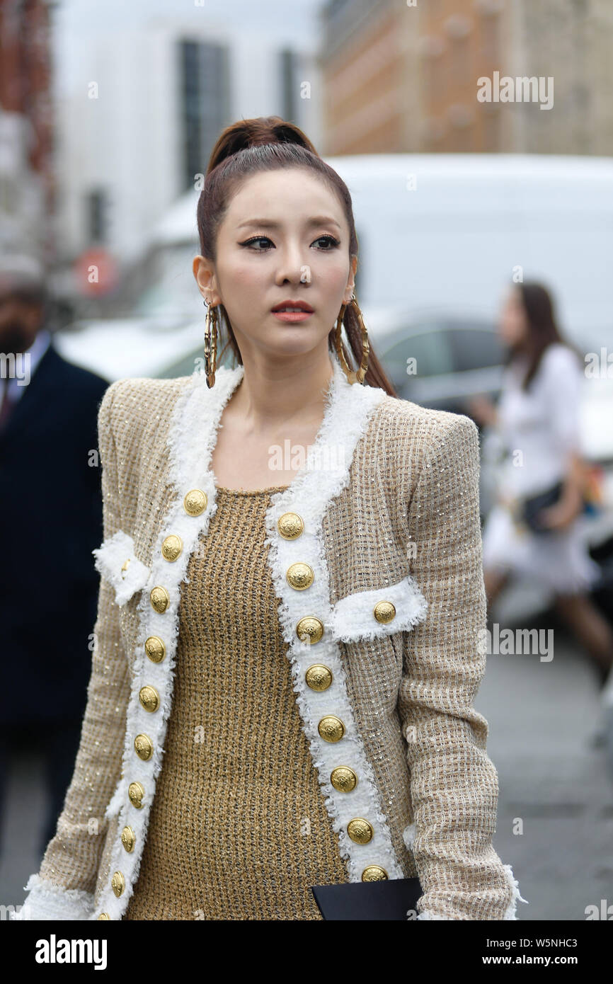 South Korean singer and actress Sandara Park, also known by her stage name Dara, poses for street snaps during the Paris Fashion Week Womenswear Fall/ Stock Photo