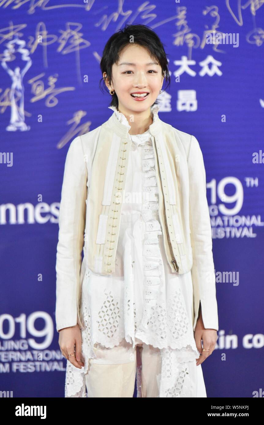 Chinese actress Zhou Dongyu poses as she arrives on the red carpet