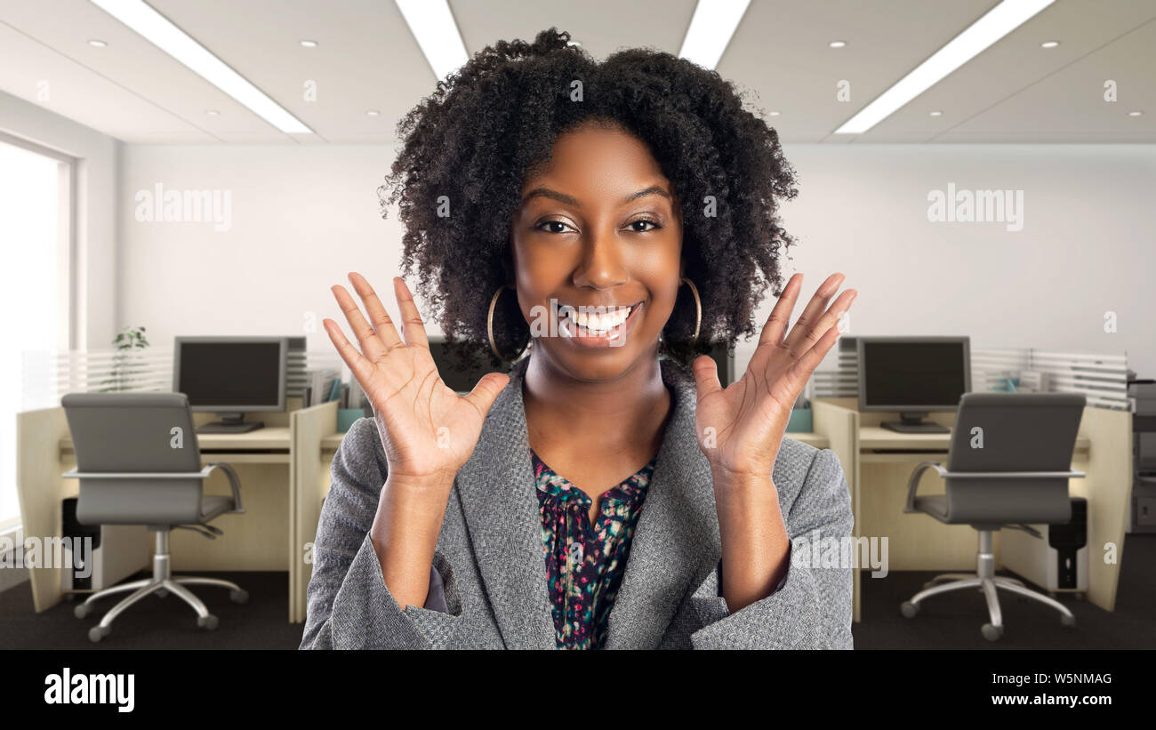 Black African American businesswoman in an office smiling happy. She is ...