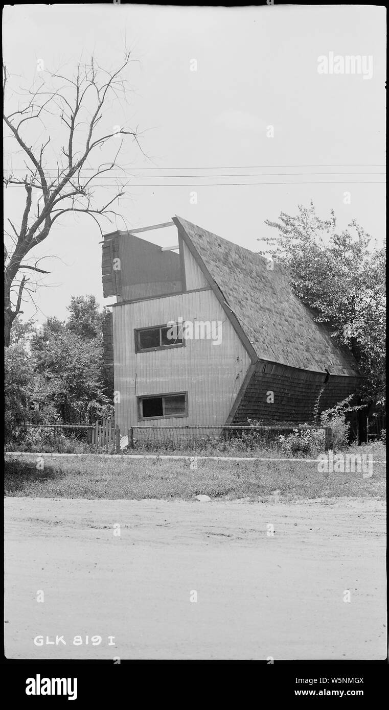 House turned over by flood Stock Photo