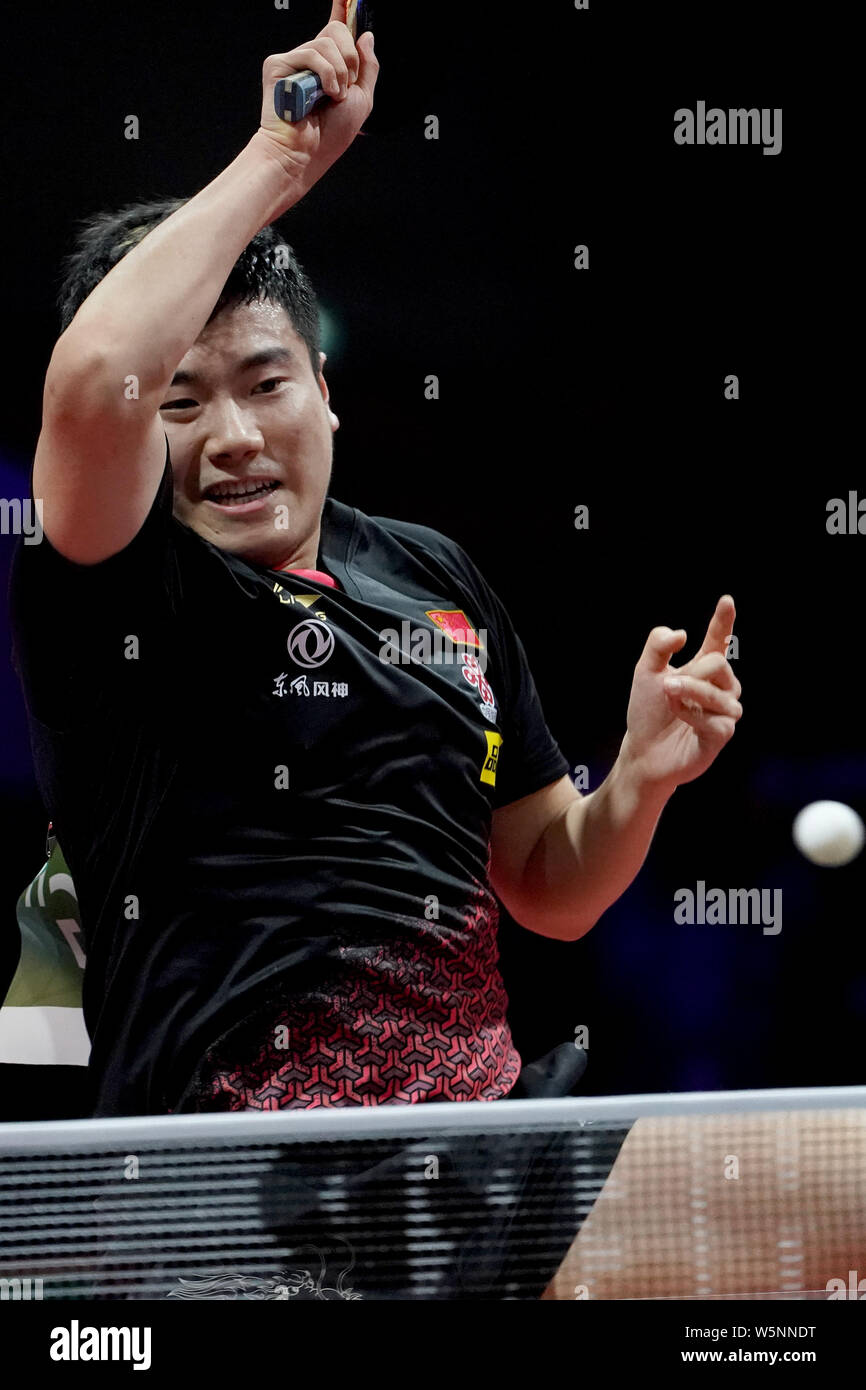 Liang Jingkun of China returns a shot to Panagiotis Gionis of Greece in their third round match of Men's Singles during the Liebherr 2019 ITTF World T Stock Photo