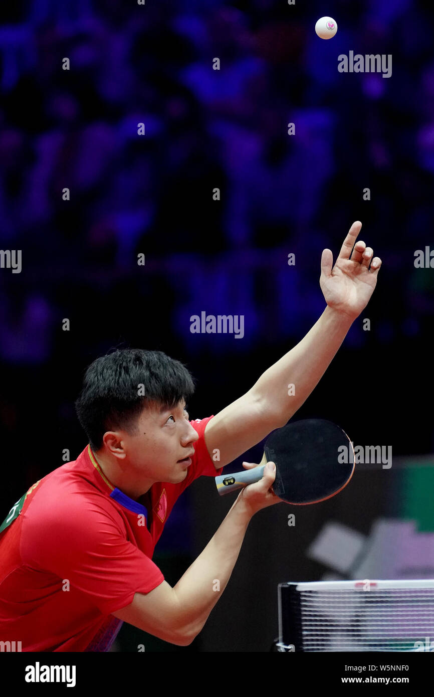 Ma Long of China serves against Aleksandar Karakasevic of Serbia in their  first round match of Men's Singles during the Liebherr 2019 ITTF World Table  Stock Photo - Alamy