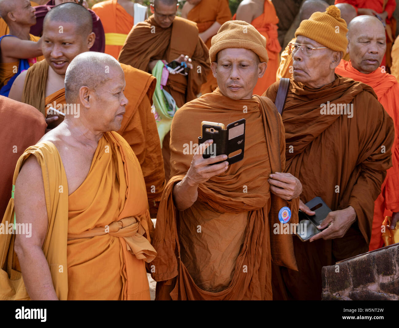 Negombo, Sri Lanka - 2019-03-22 - Monks Gather Together and a Phone Camera Comes Out. Stock Photo