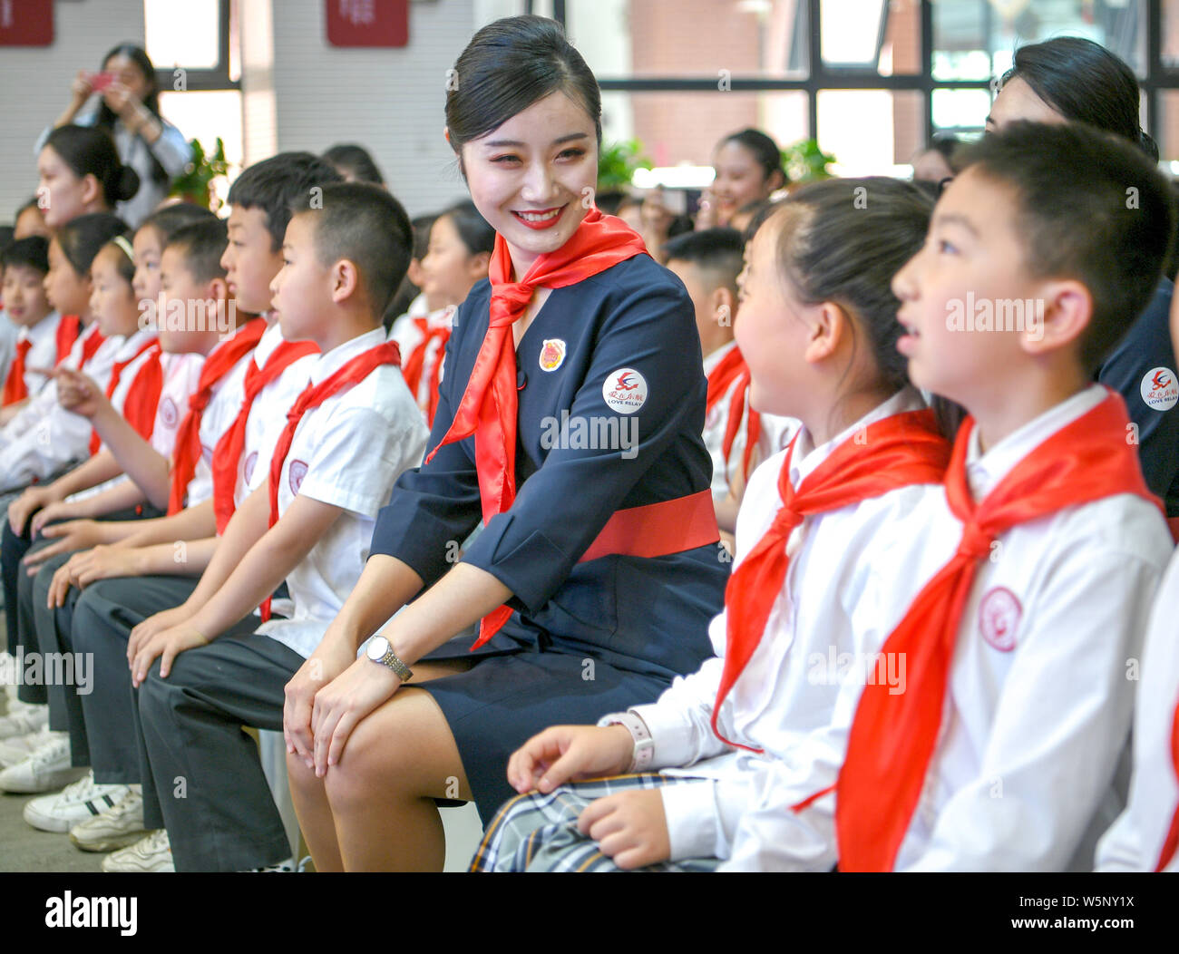 A Flight Attendant From China Eastern Airlines Interacts With