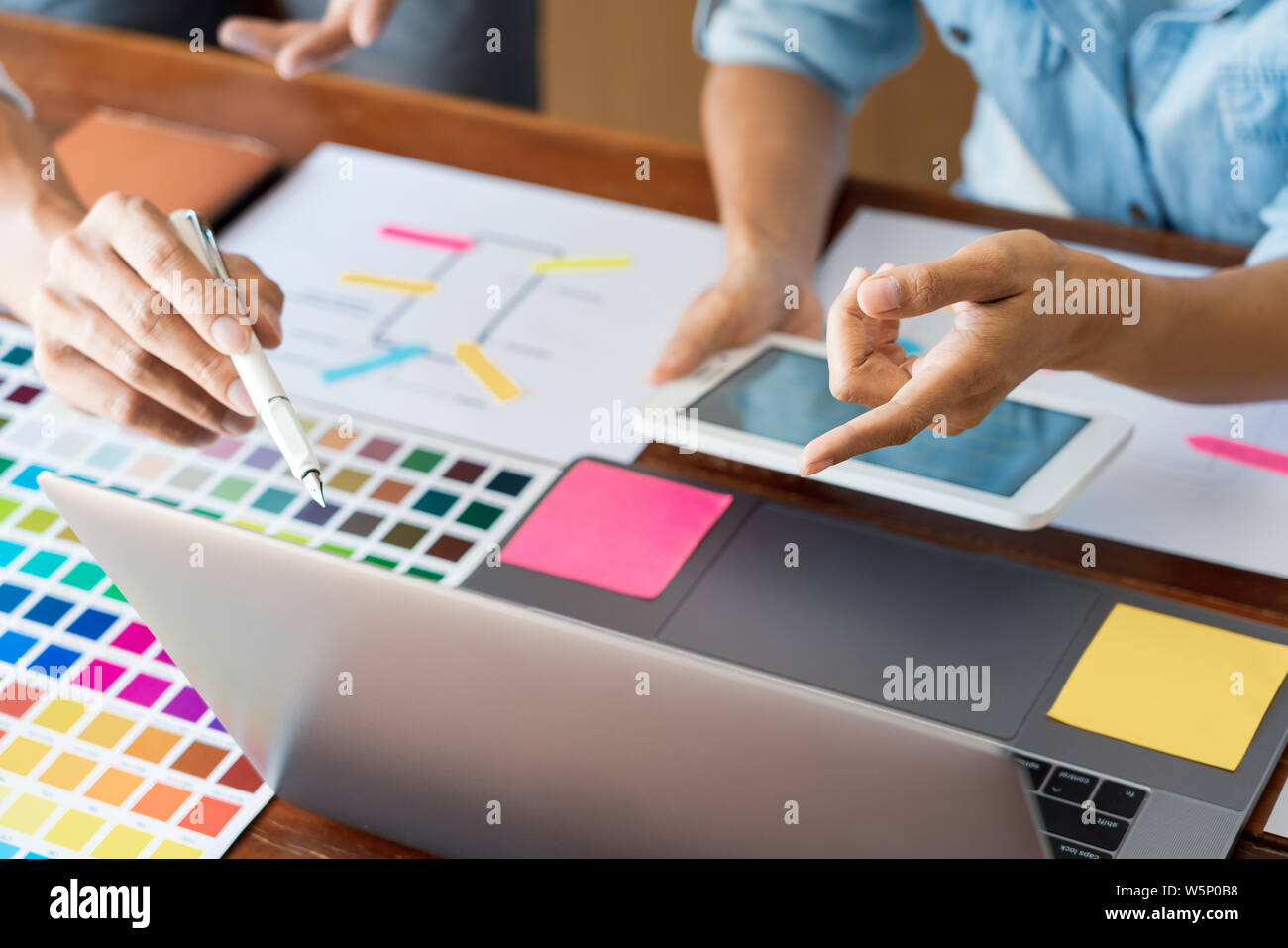 business technology concept, creative team designer choosing samples ...