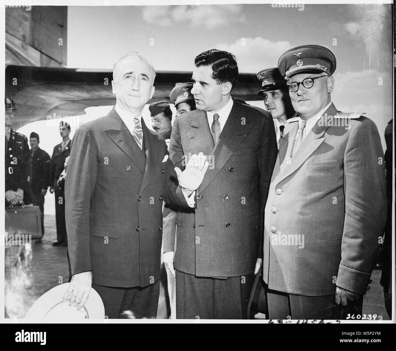 James Byrnes with Gromyko and Vishinsky; Scope and content:  Secretary of State James Byrnes (left) is greeted at the airport en route to the Potsdam Conference by Soviet Ambassador to the United States Andrei Gromyko (center) and Soviet Foreign Affairs Minister Andre Vishinsky(right). Stock Photo