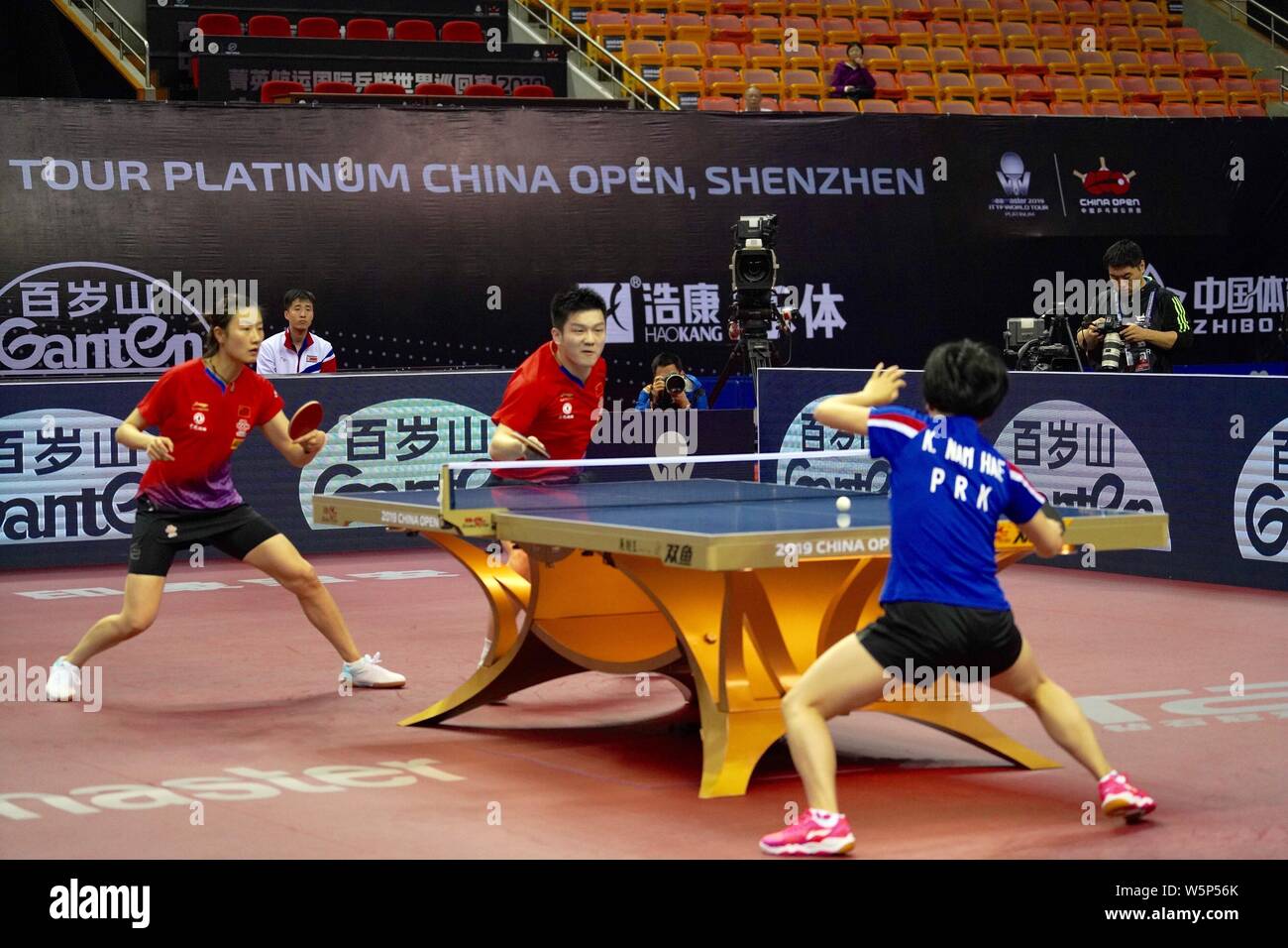 Fan Zhendong and Ding Ning of China return a shot to An Ji Song and Kim ...