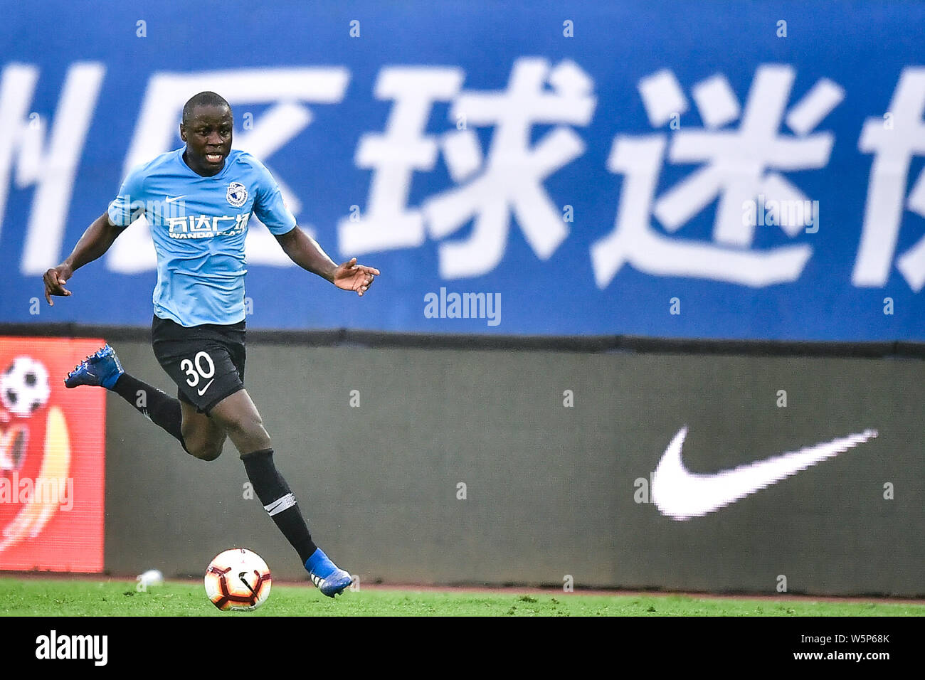 Zimbabwean football player Nyasha Mushekwi of Dalian Yifang dribbles