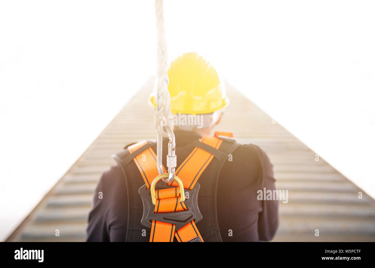 Industrial Worker with safety protective equipment loop in his back, safety concept Stock Photo