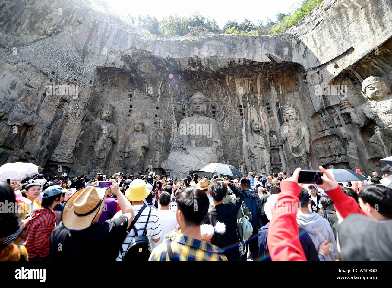 Tourists exploring Longmen Grottoes