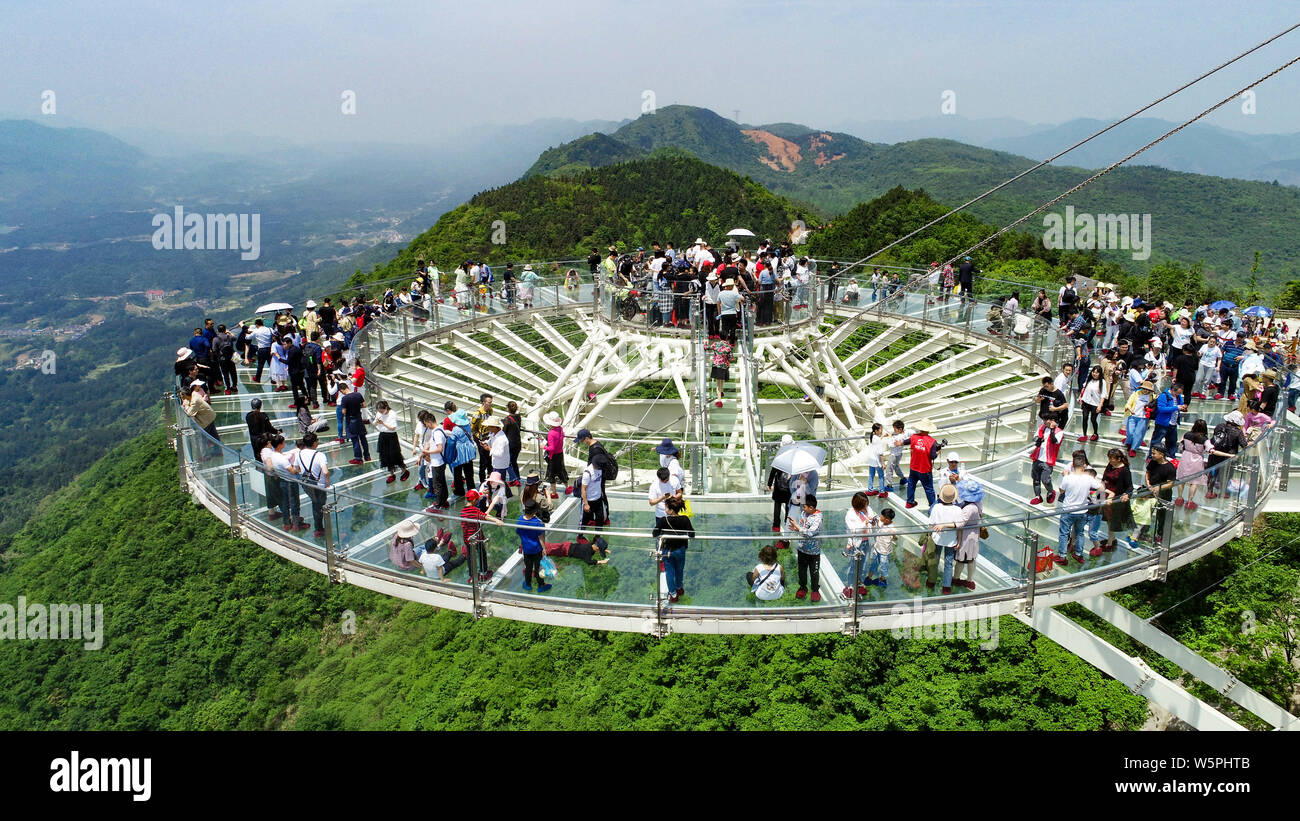 Holidaymakers walk on the 