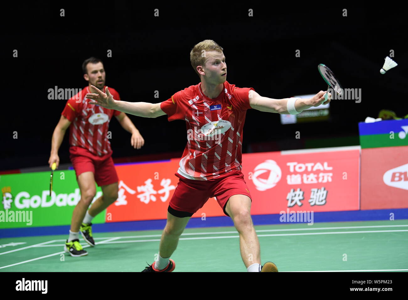 Kim Astrup and Anders Skaarup Rasmussen of Denmark return a shot to Li  Junhui and Liu Yuchen of China in their group 1 match of Men's Doubles  during t Stock Photo - Alamy
