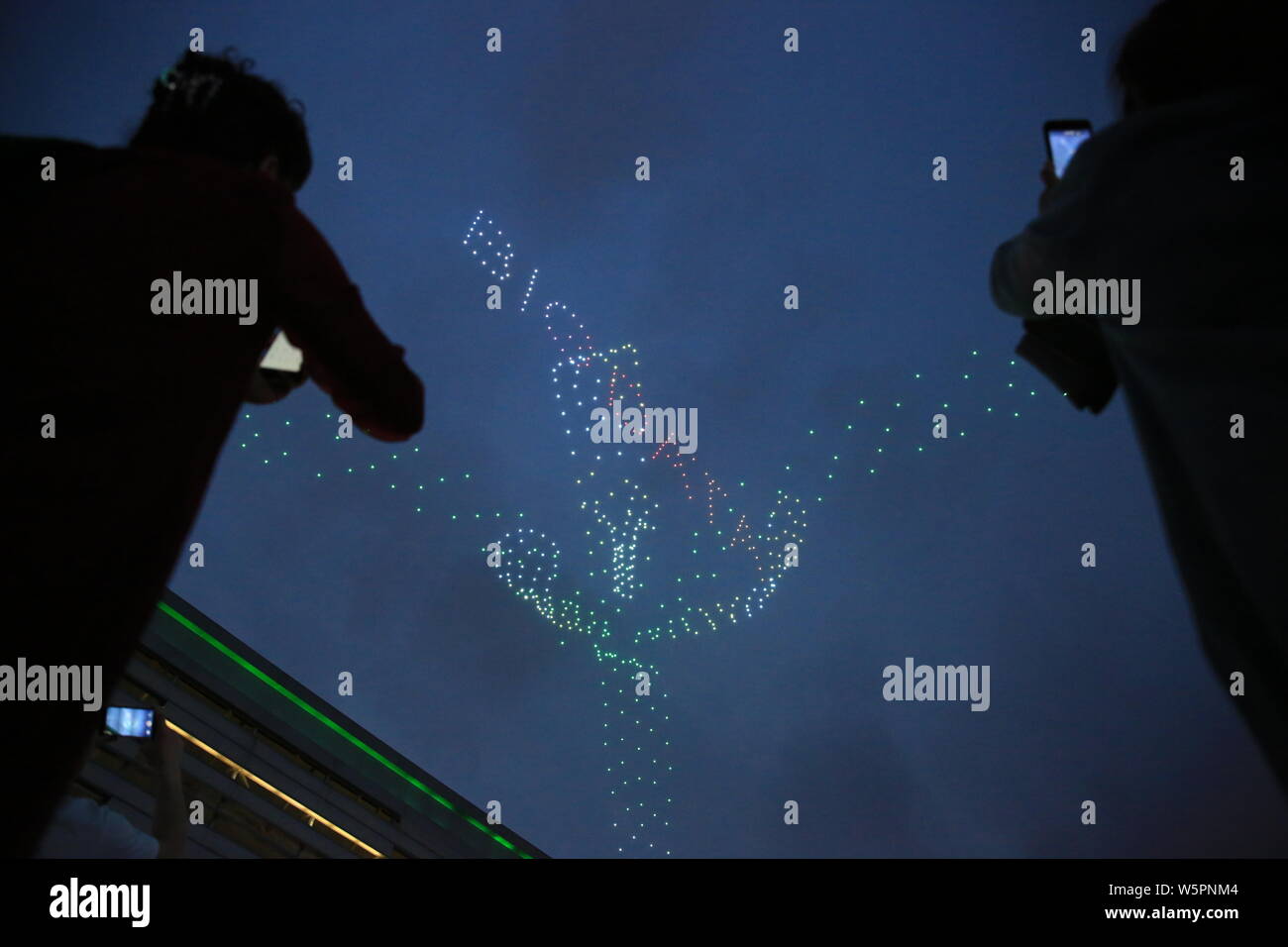 Drones or UAVs (unmanned aerial vehicles) are remote-controlled to form patterns of 'Big Data' in first rehearsal for the light shows during the China Stock Photo