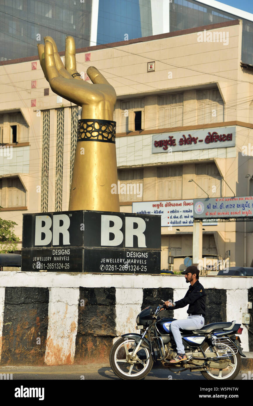 Hand sculpture in traffic island Surat Gujarat India Asia Stock Photo