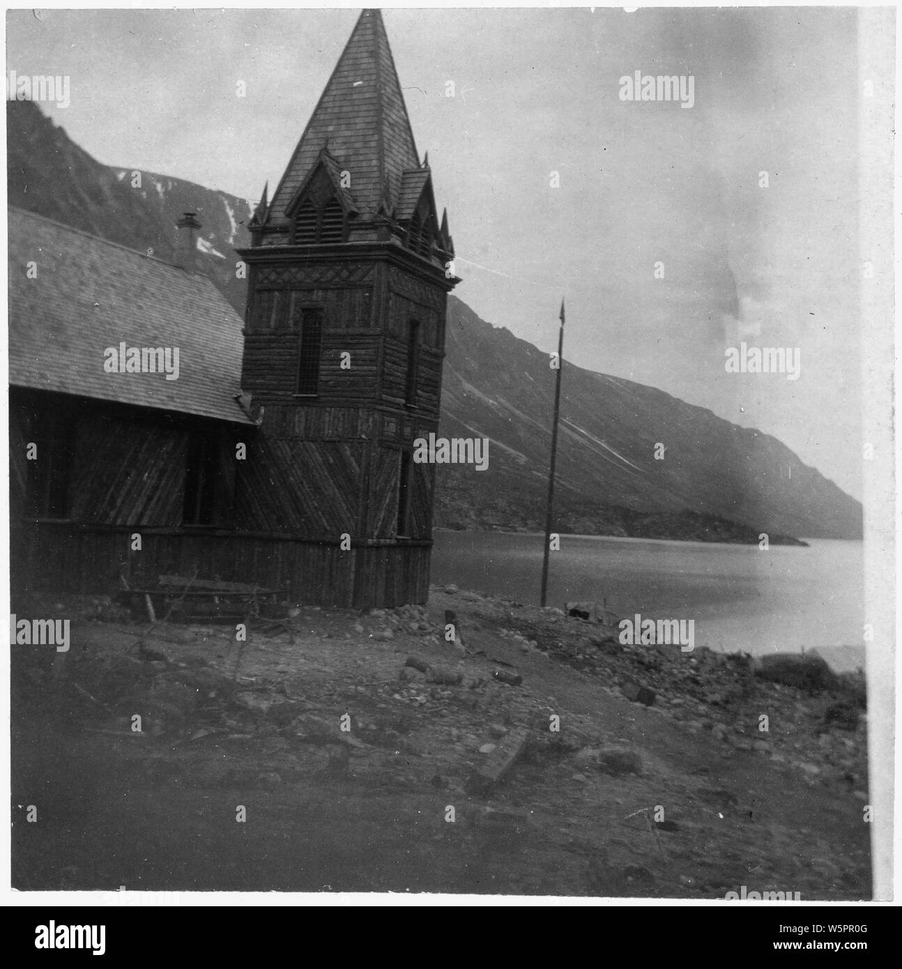 Lake Bennet on W.P. and Y.R.R. Old Church on left, mountains in the background. Stock Photo