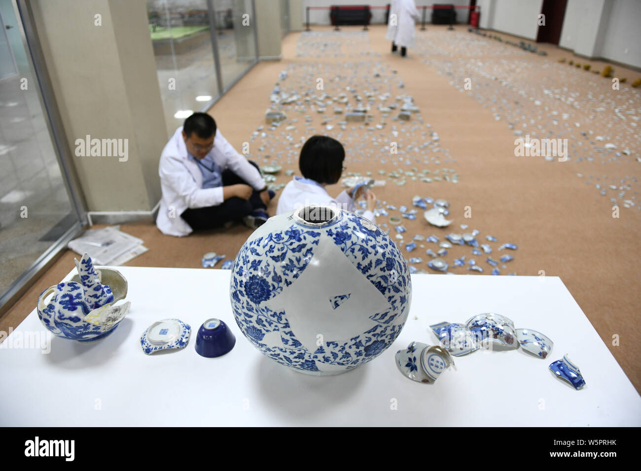 Chinese archaeologists restore cultural relics unearthed from the Old Summer Palace, known as Yuanmingyuan or Yuan Ming Yuan, for the 'Restoration 186 Stock Photo