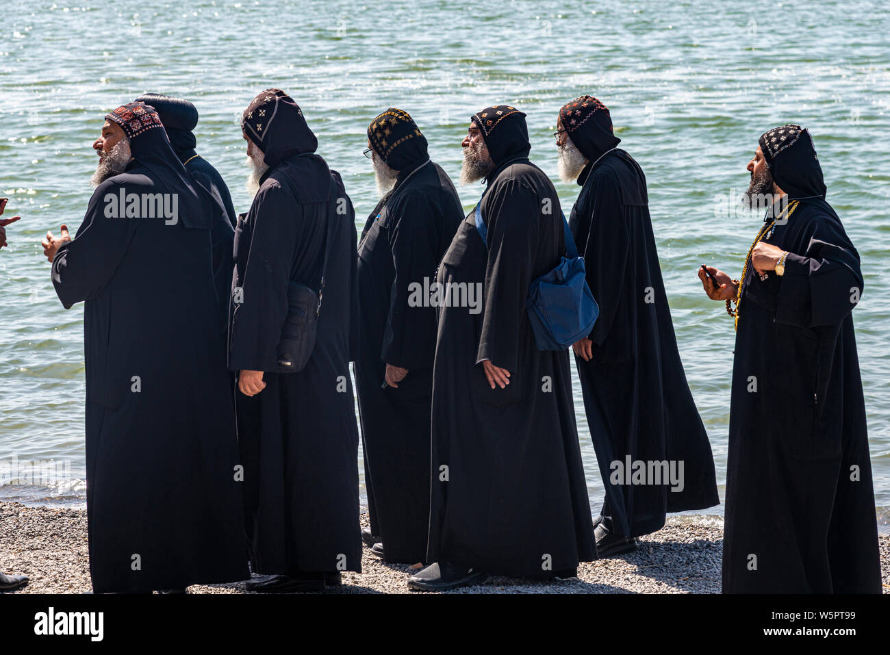 Tabgha, Israel - May 18 2019 : Coptic monks at the church in Tabgha beside Sea of Galilee Stock Photo
