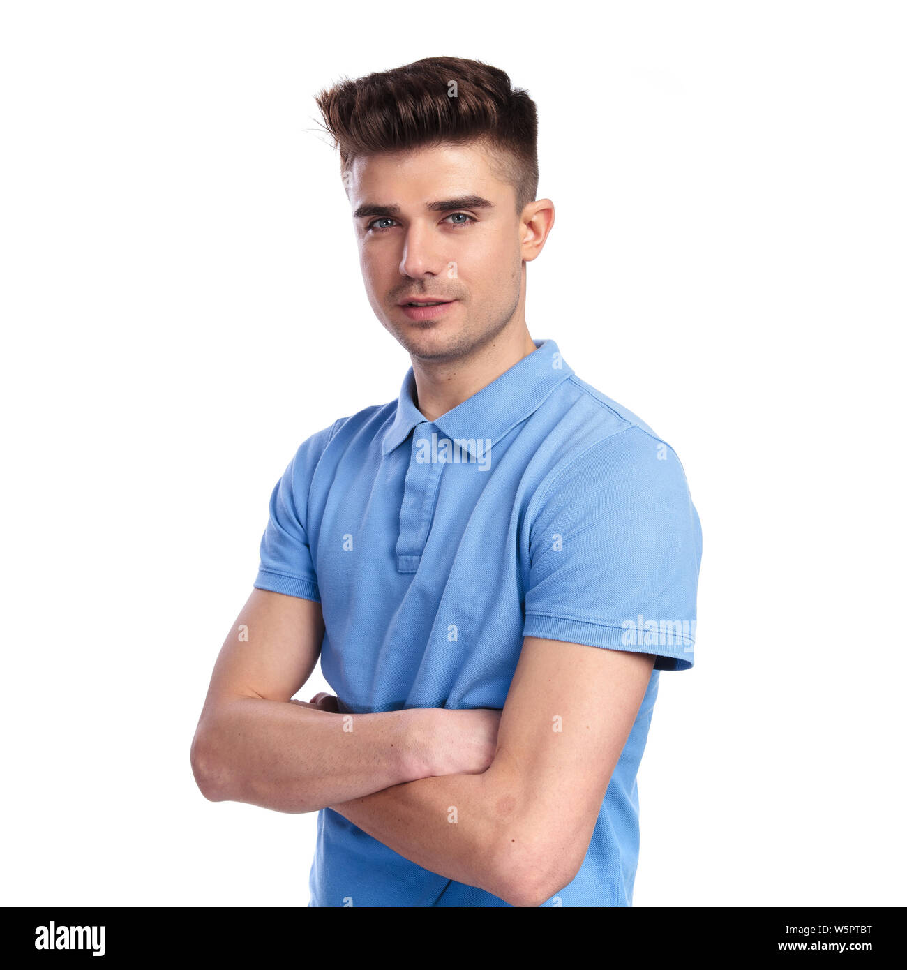 portrait of a confident casual man with hands crossed on white ...