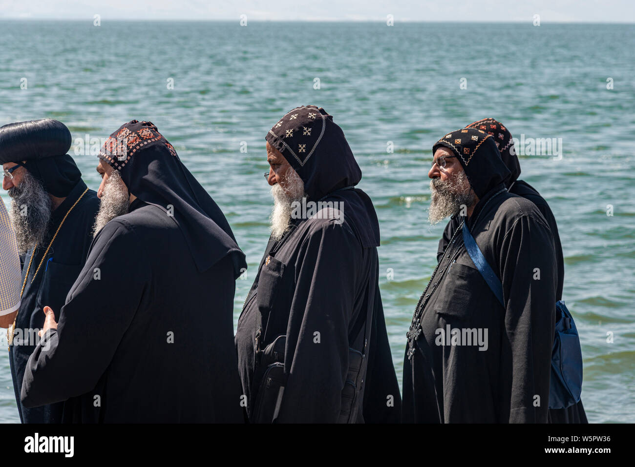 Tabgha, Israel - May 18 2019 : Coptic monks at the church in Tabgha beside Sea of Galilee Stock Photo