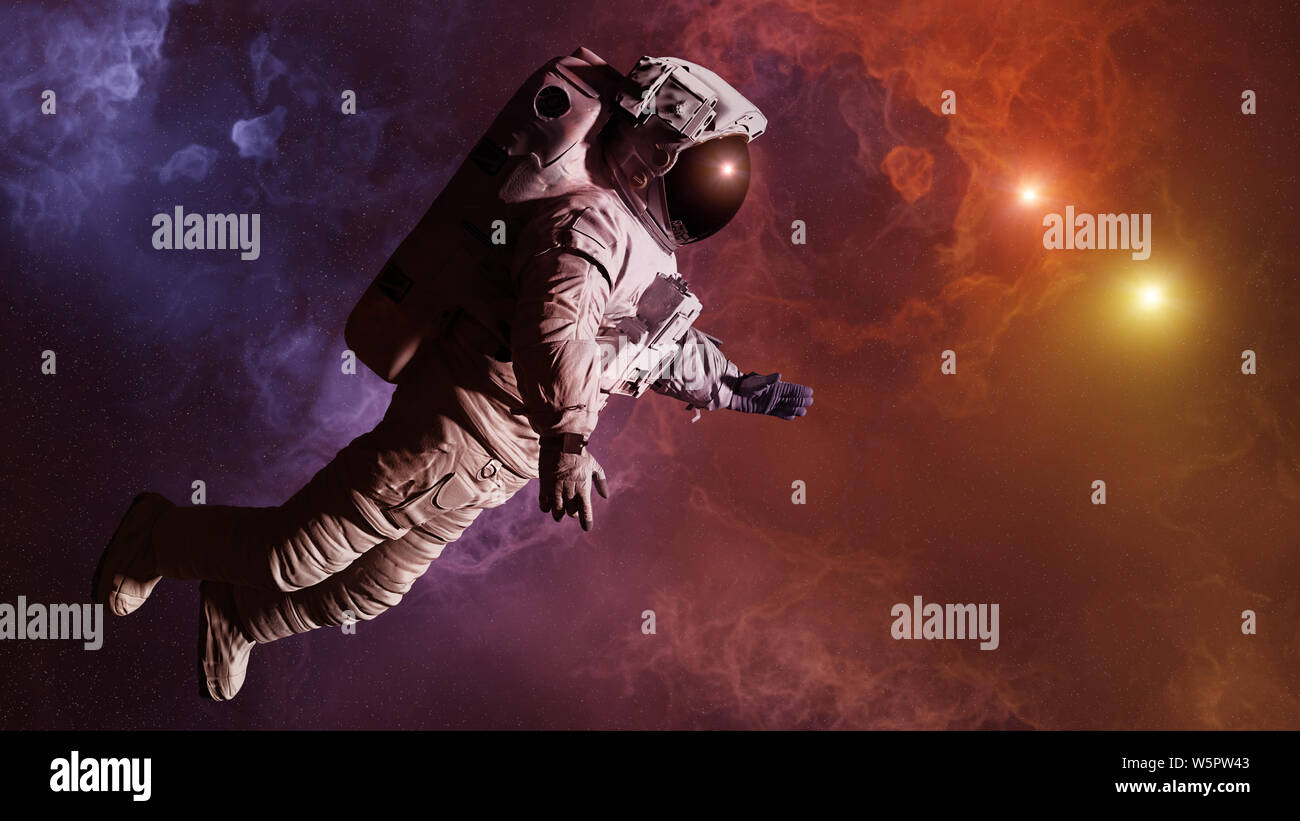 astronaut in colorful nebula close to a binary star system Stock Photo