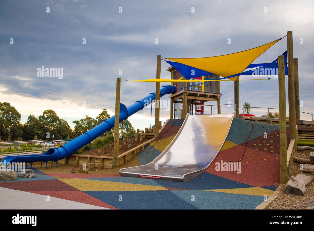 The slide area is covered by sun shade sails in a new children's playground in Rolleston, New Zealand Stock Photo