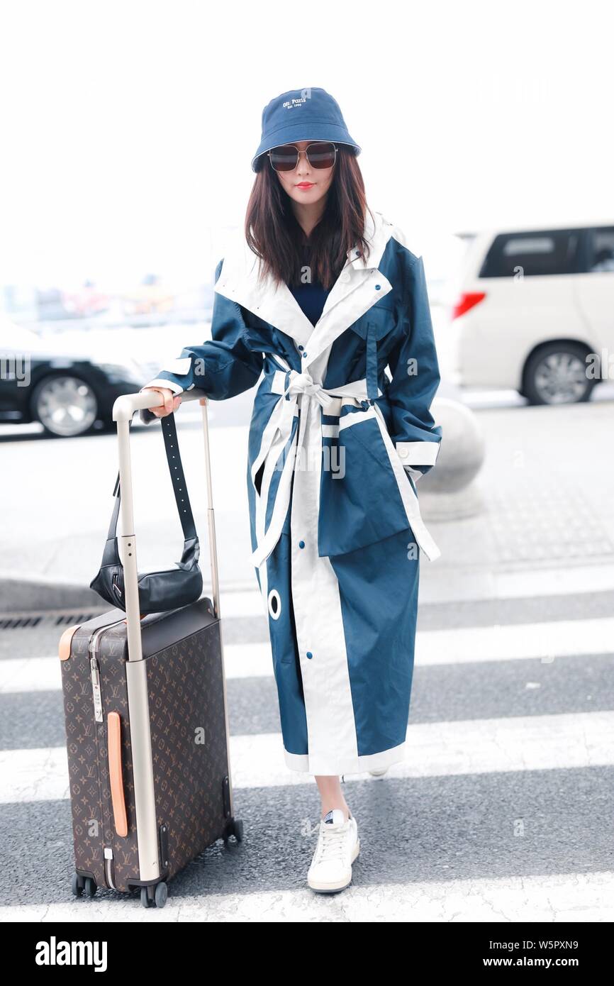 Chinese actress Crystal Zhang or Zhang Tian'ai arrives an airport before departure in Shanghai, China, 14 May 2019.   Boot: Louis Vuitton Stock Photo