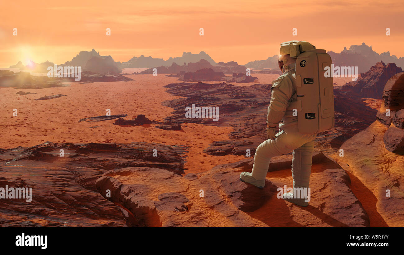 astronaut on planet Mars watching the rising Sun Stock Photo