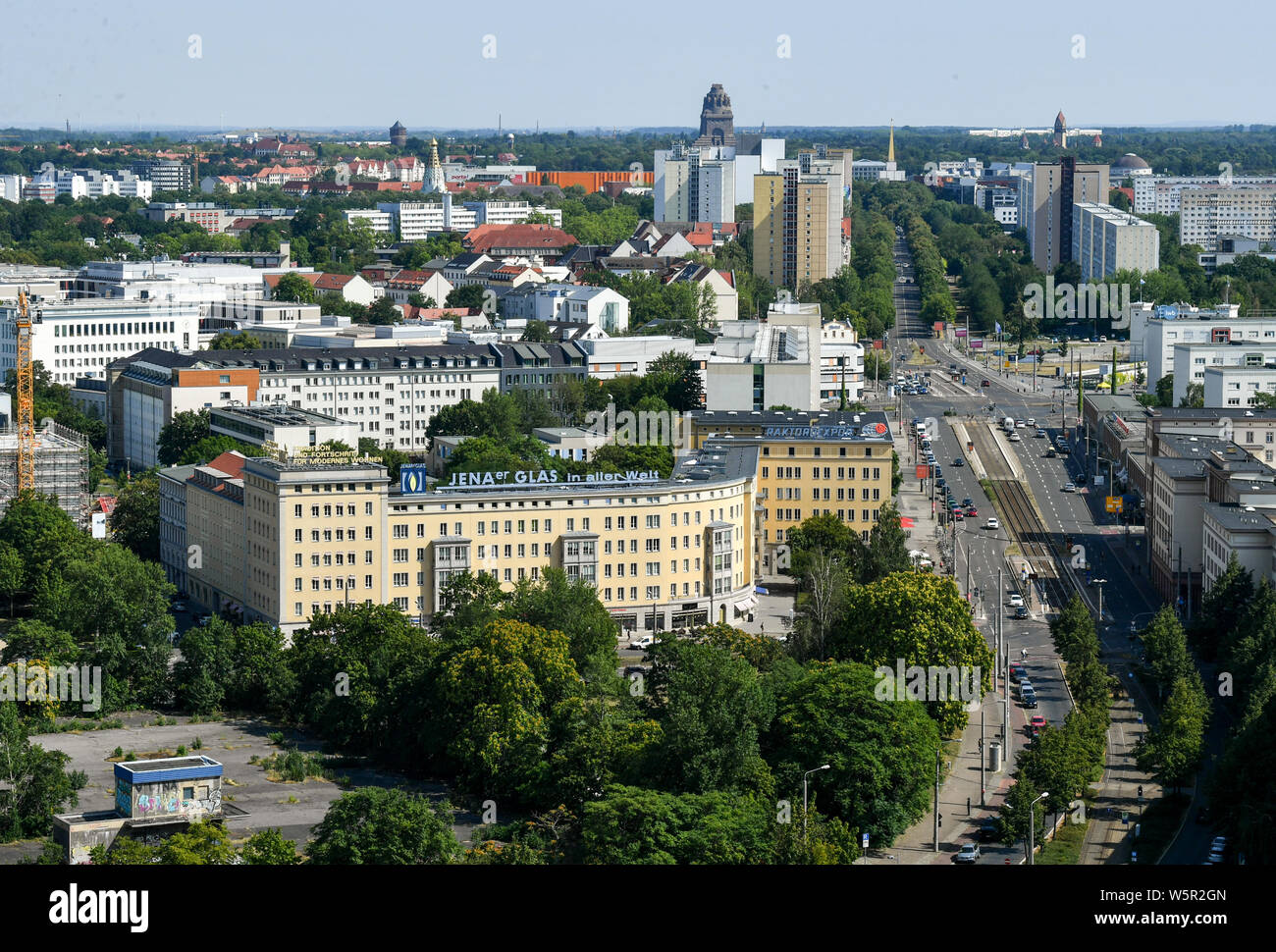 Leipzig, Germany. 25th July, 2019. Panoramic view from the tower of the New  Town Hall to the city centre of Leipzig with the Windmühlenstraße with the  Bavarian railway station (M, r) in