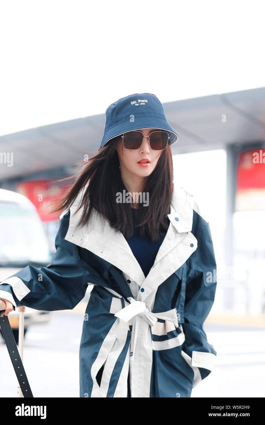 Chinese actress Crystal Zhang or Zhang Tian'ai arrives an airport before departure in Shanghai, China, 14 May 2019.   Boot: Louis Vuitton Stock Photo