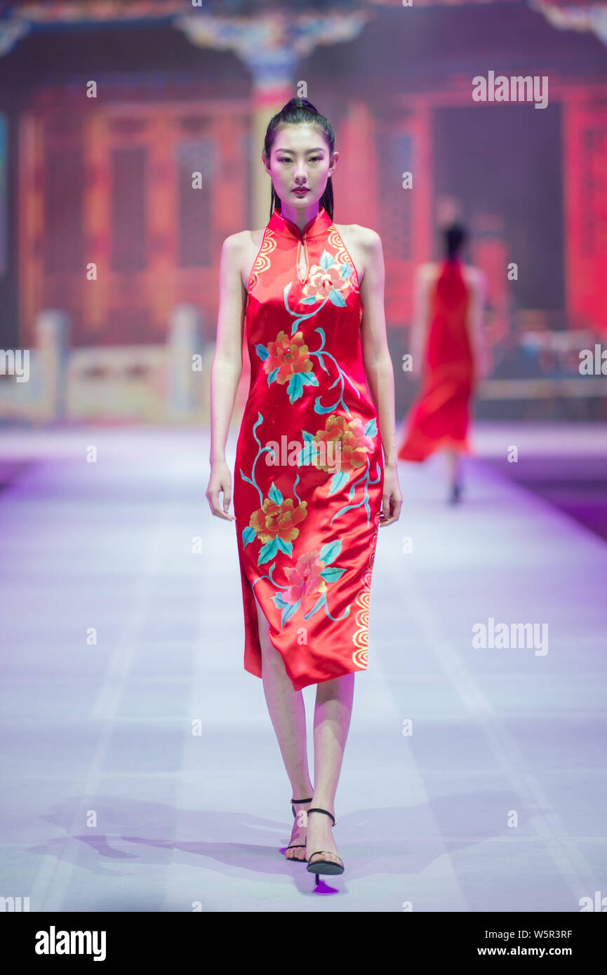 A model dressed in Cheongsam a traditional Chinese dresses also known as Qipao poses during the 2019 China Tailored Cheongsam Art Show in Shenyang c Stock Photo Alamy
