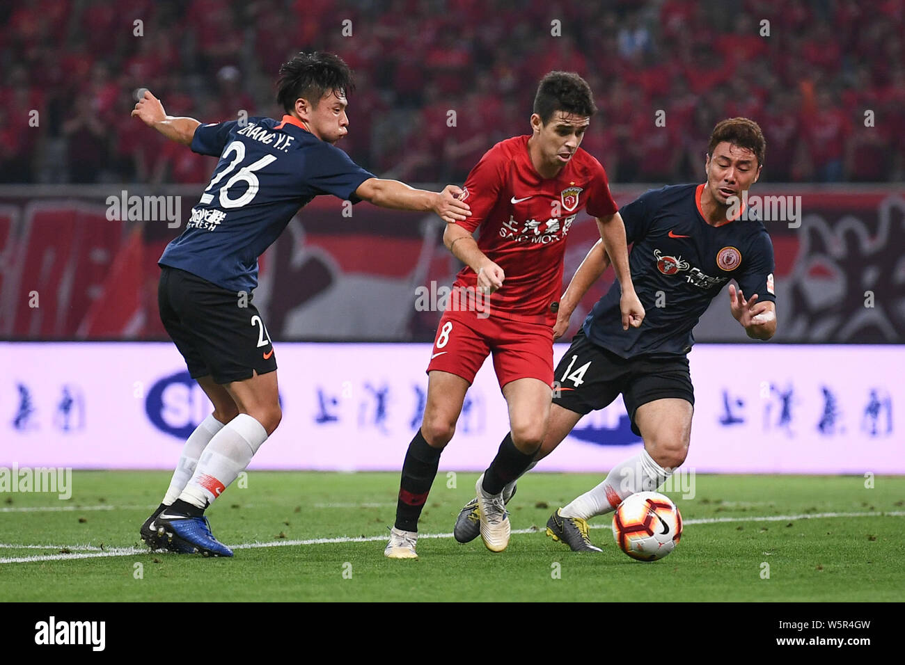 Brazilian football player Oscar dos Santos Emboaba Junior, better known as simply Oscar, center