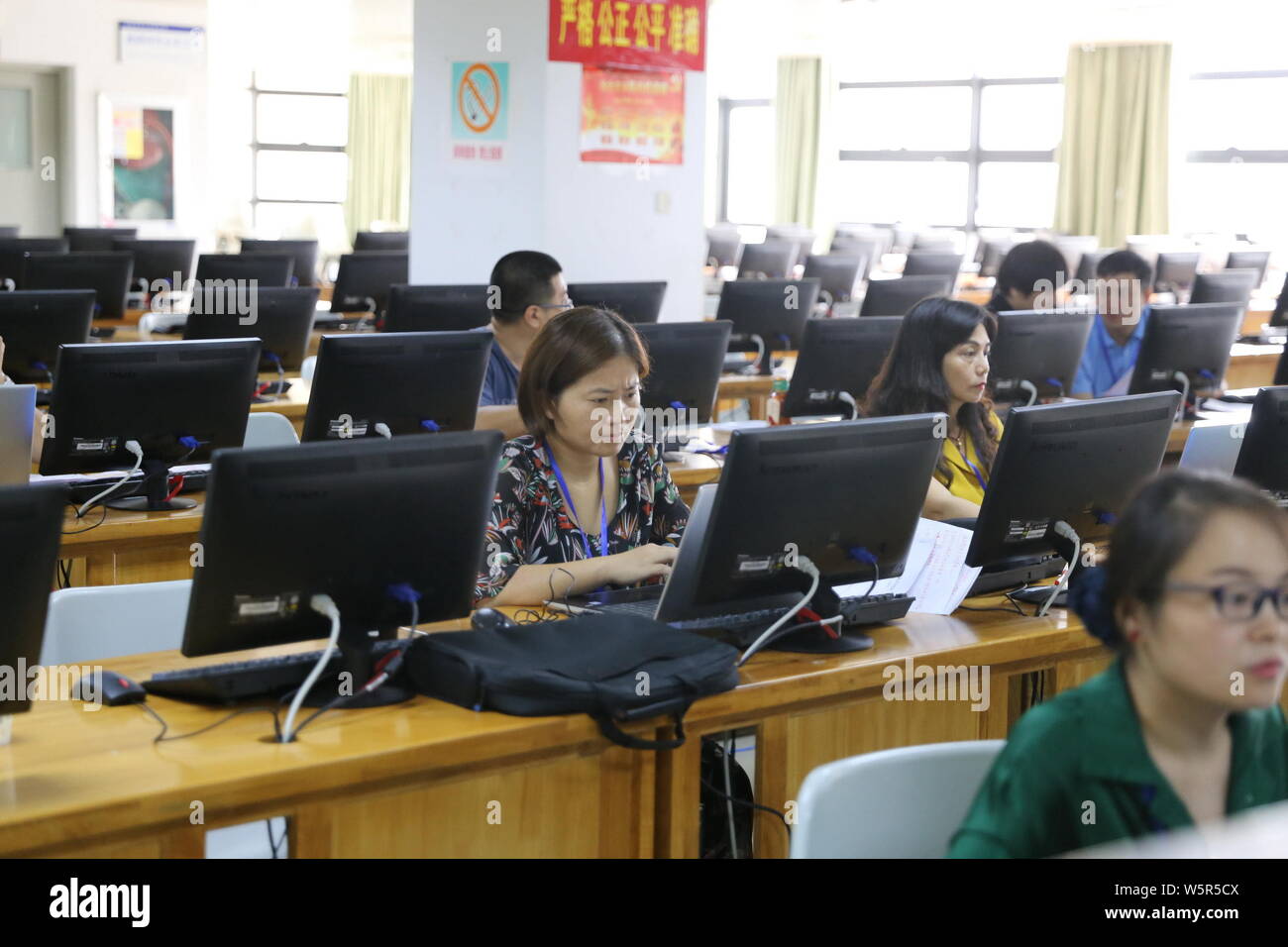 Chinese teachers mark test paper of students who attend 2018 National  College Entrance Examination, or Gaokao, on the computers at the campus of  Haina Stock Photo - Alamy