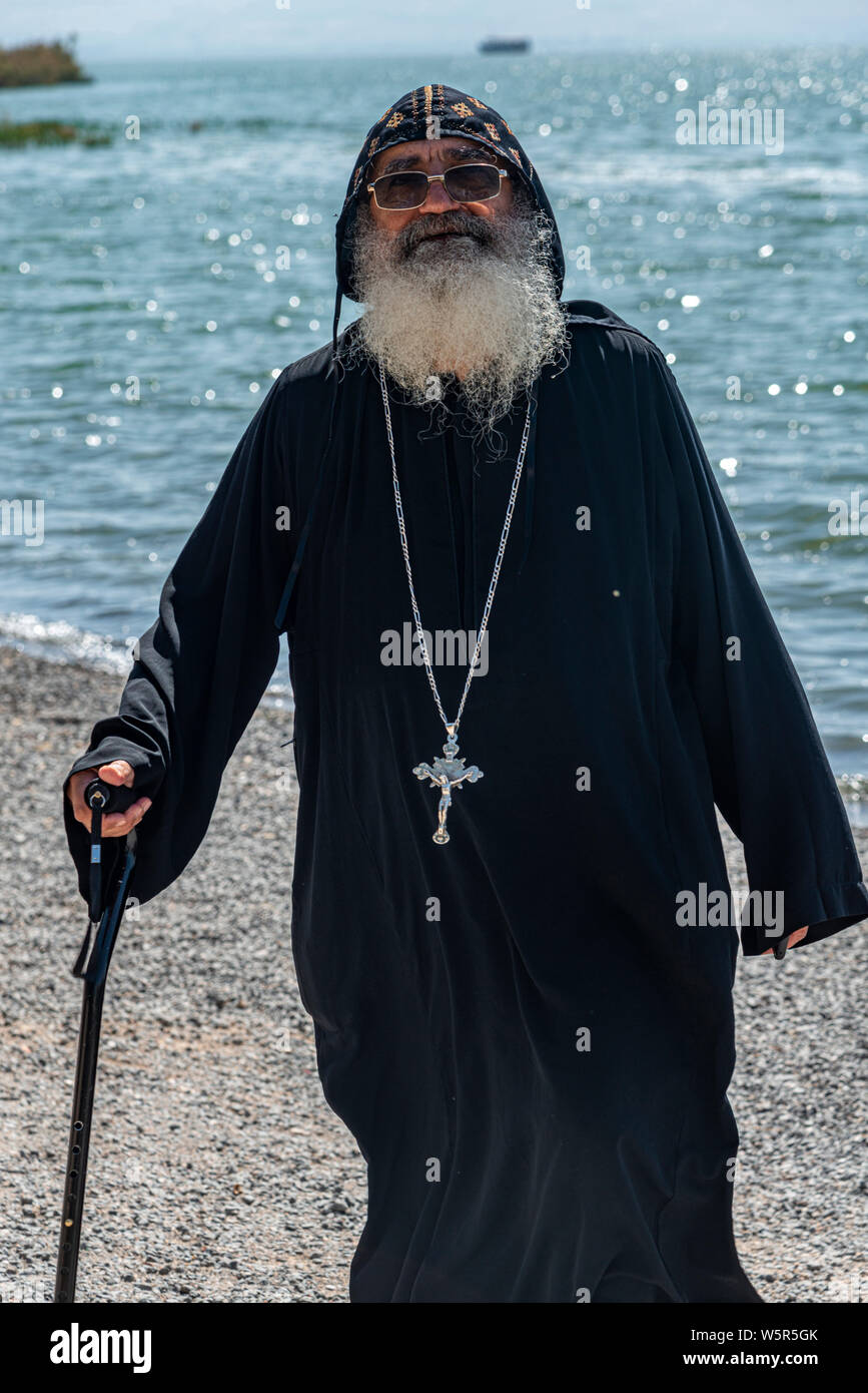 Tabgha, Israel - May 18 2019 : Coptic monk at the church in Tabgha beside Sea of Galilee Stock Photo