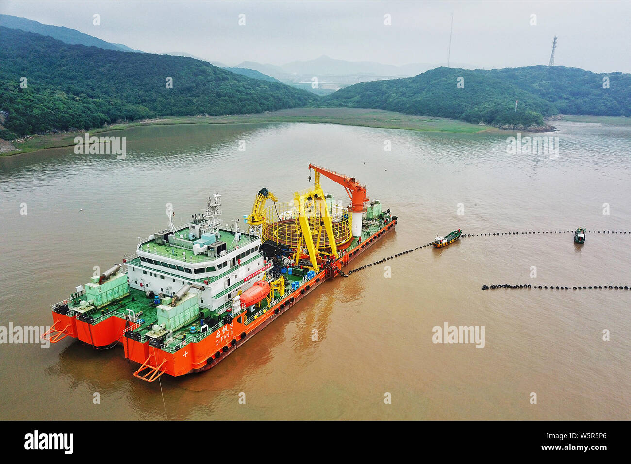 Chinese workders labor at the construction site of the 500kilovolt (kv