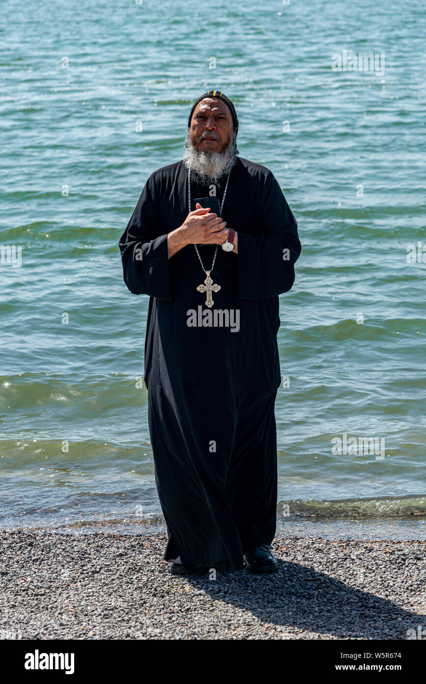 Tabgha, Israel - May 18 2019 : Coptic monk at the church in Tabgha beside Sea of Galilee Stock Photo