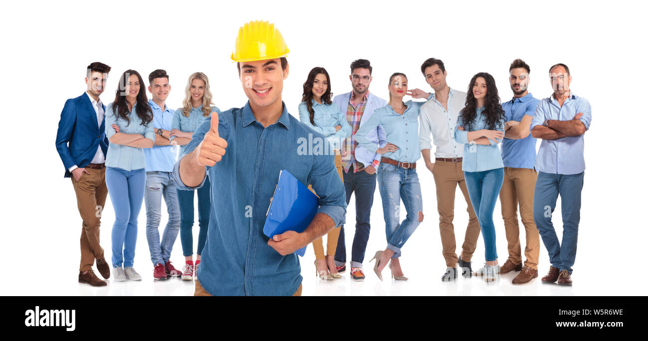 young casual team with engineer leader making ok sign in front ...