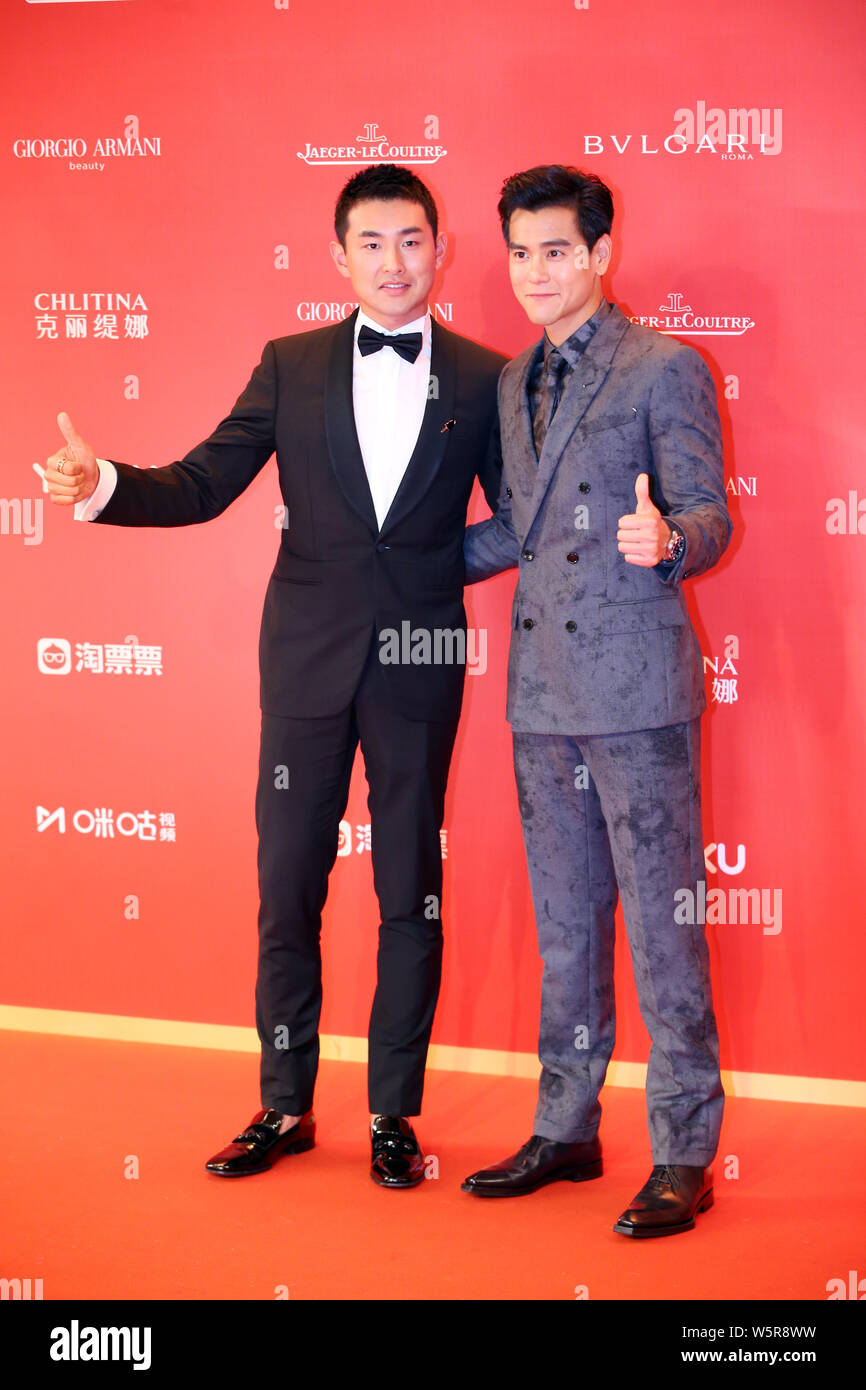 Taiwanese actor Eddie Peng, right, and Chinese actor Wang Yanlin arrive