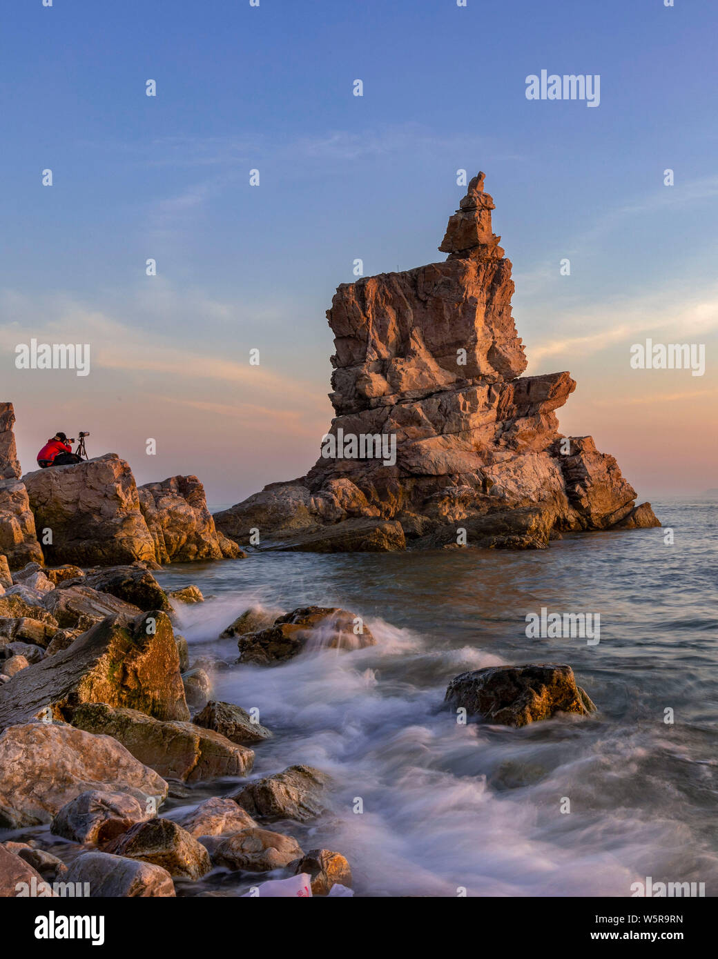 Landscape of the Jiangjunshi Scenic Zone, which is famous for its coastal landforms, at sunset in Dalian city, northeast China's Liaoning province, 31 Stock Photo