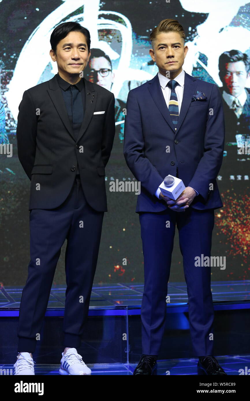 Hong Kong singers and actors Tony Leung Chiu-wai, left, and Aaron Kwok attend a press conference for new movie 'Theory of Ambitions' during the 22nd S Stock Photo