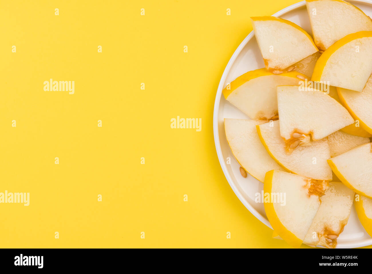 Sliced Yellow Musk Melon Served on Plate, Pastel Background and Copy Space. Stock Photo