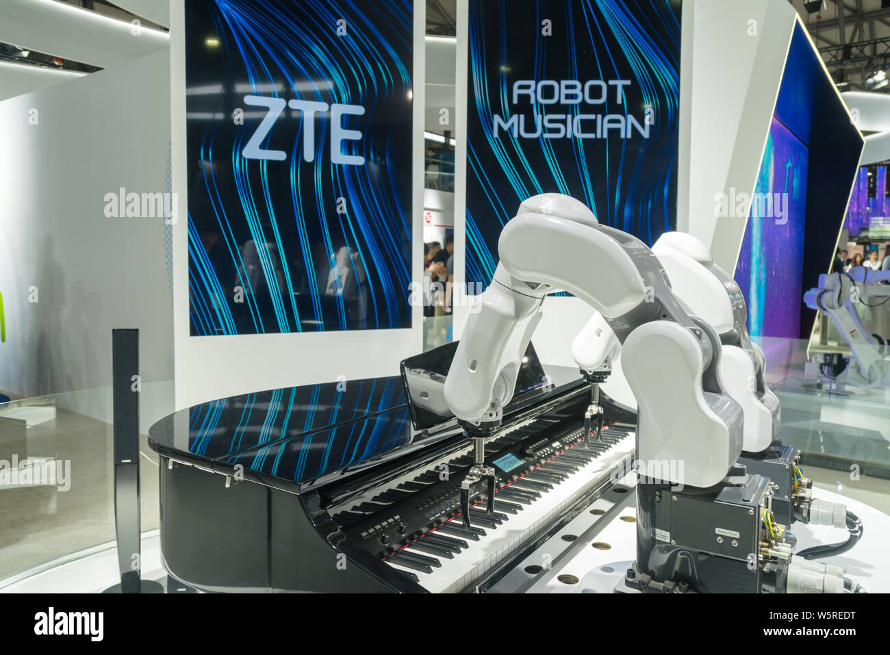 A robot arm of ZTE plays the piano during the 2019 Mobile World Congress (MWC) in Shanghai, China, 26 June 2019.  The 5G technology dominates the Mobi Stock Photo