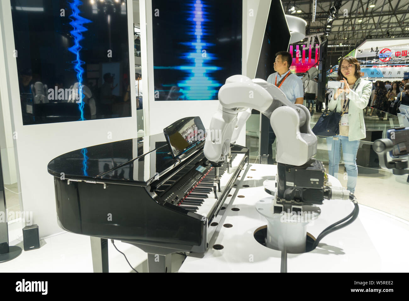 A robot arm of ZTE plays the piano during the 2019 Mobile World Congress (MWC) in Shanghai, China, 26 June 2019.  The 5G technology dominates the Mobi Stock Photo