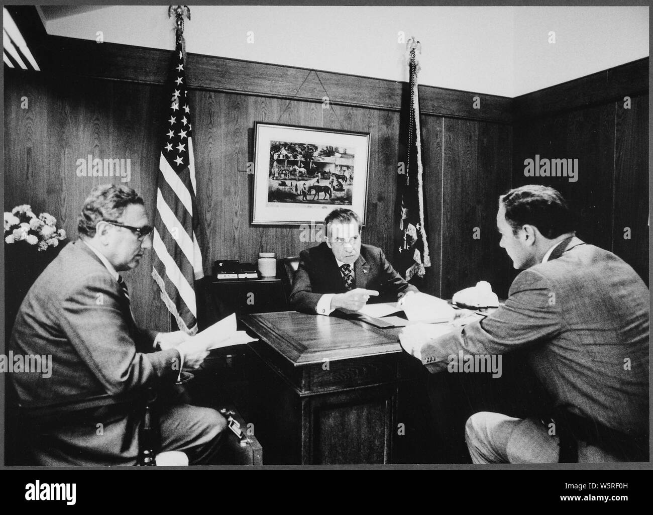 Meeting at Camp David to discuss the Vietnam situation; Scope and content:  Pictured: Secretary of State Henry A. Kissinger, President Nixon, Maj. Gen. Alexander M. Haig Jr., Deputy Assistant. Subject: Staff with President- Group. Stock Photo