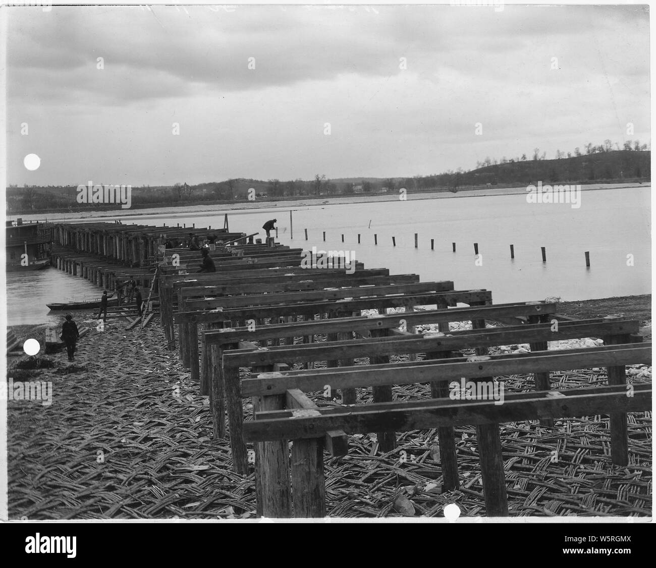 Men build what appears to be a pier Stock Photo Alamy
